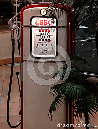 Vintage gas pump near a palm tree Editorial Stock Photo