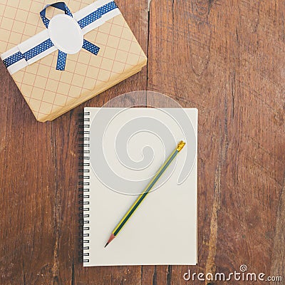 Vintage gift box on wood background with notebook Stock Photo