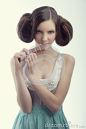 A vintage girl eating chocolate Stock Photo