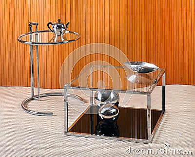 Vintage Glass and Chrome Tables with Deco Objects Stock Photo