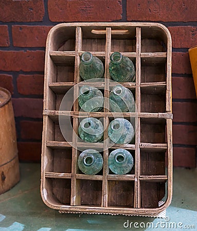 Vintage glass Coca Cola bottles in crate Editorial Stock Photo