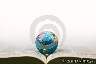Vintage globe with open Bible Stock Photo