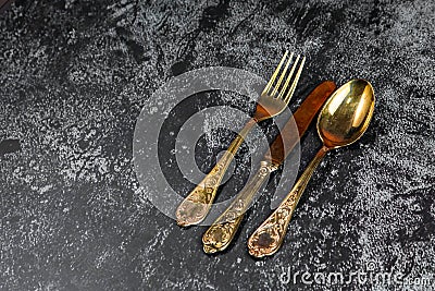 Vintage golden dinner set on a grundge blue background Stock Photo