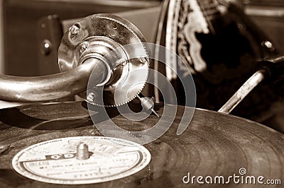 Vintage gramophone with a vinyl. Sepia Stock Photo