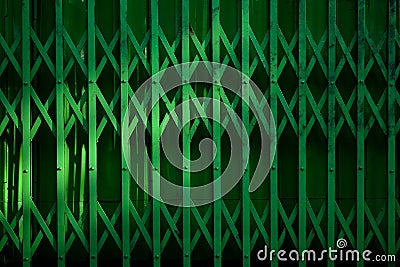 Vintage green metal slide door and the shadow. Stock Photo