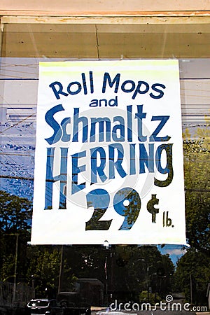 Vintage Grocery Store Sign Roll Mops and Schmaltz Herring 29 Cents per Lb circa 1940`s 1950`s 1960`s Editorial Stock Photo