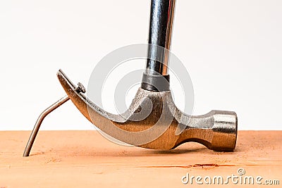 Vintage hammer nail puller pull bent big nail out of the board Stock Photo