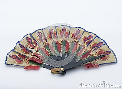 Vintage hand folding fan made of hand-decorated buffalo leather. Stick made of wood. Hand painted and decorated hand folding Stock Photo