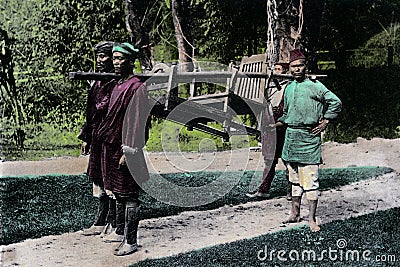 Vintage hand Tinted photo `Dandy and Bearers, early 20th century. Artist: Unknown West Bangal Editorial Stock Photo