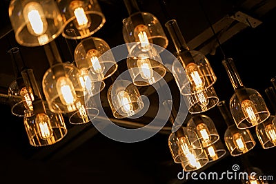 Vintage hanging light bulbs on dark background Stock Photo