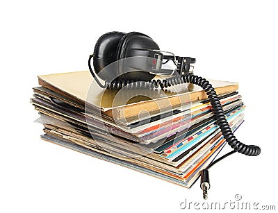 Vintage headphones on the stack of vinyl records Stock Photo