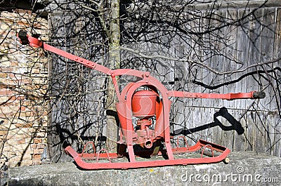 Vintage historical two men fire pump for water Stock Photo