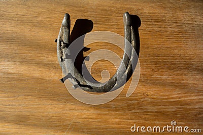 Vintage horse shoe with metal nails, talisman, good luck charm Stock Photo