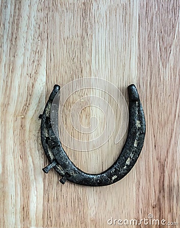 Vintage horse shoe with metal nails, talisman, good luck charm Stock Photo