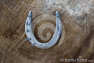 Vintage horse shoe with metal nails, talisman, good luck charm Stock Photo