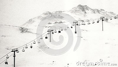 Vintage image of people in chairlift Stock Photo