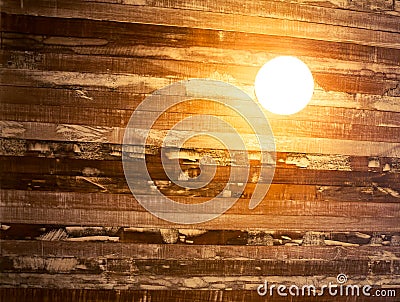 Vintage incandescent on wooden wall. Stock Photo