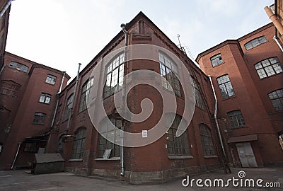 Vintage industrial red brick building in the industrial area of the old European city. Stock Photo