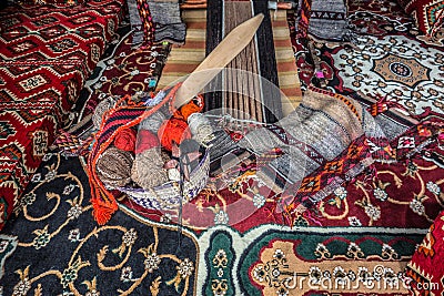 Vintage interior of arabic house with loom and carpets Stock Photo