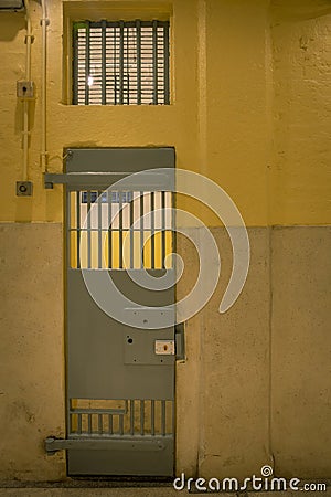 vintage iron jail door in prison building with copy space in cinematic tone Stock Photo