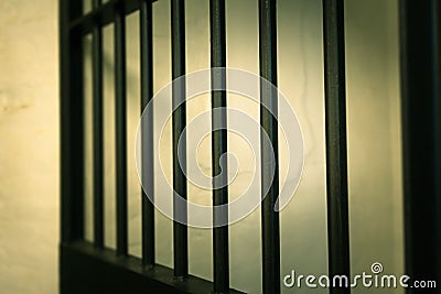 vintage iron jail door in prison building with copy space in cinematic tone Stock Photo