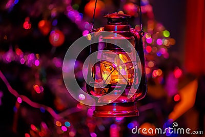Vintage kerosene lantern Christmas night and bright blurred beautiful background with bokeh. Soft focus. Stock Photo