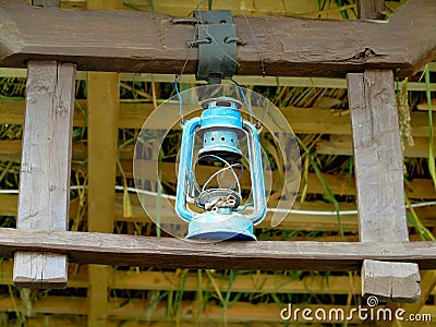 Vintage kerosene lantern lamp in an antique rustic country barn Stock Photo