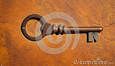 Vintage Key on Textured Orange Background Stock Photo