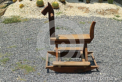 Vintage Kids Toy Rocking Horse Made Of Wood Set Outdoors In Selective Focus Garden Stock Photo