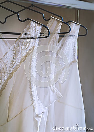 Vintage lace bridal lingerie on hangers Stock Photo