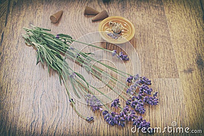 Vintage lavender flowers and incense aroma cones on a wooden table Stock Photo