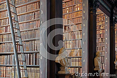 Vintage library with shelves of old books in the Long Room in the Trinity College Editorial Stock Photo