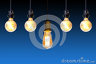 Vintage light bulb hanging over dark blue background, Idea concept Stock Photo