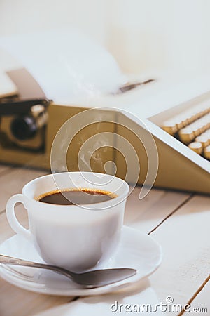 Vintage looking coffee and typing machine on a desk Stock Photo