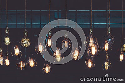 Vintage luxury light lamp hanging decor glowing in dark. Stock Photo