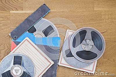 Vintage magnetic audio reels on the grunge wooden floor Stock Photo