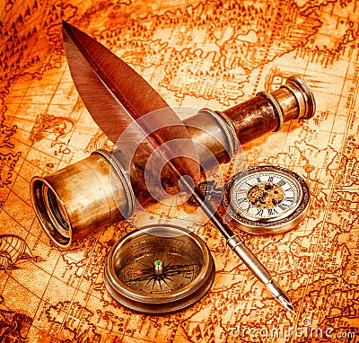 Vintage magnifying glass lies on an ancient world map Stock Photo