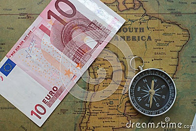 Vintage map of South America with ten euro and a compass, close-up Stock Photo