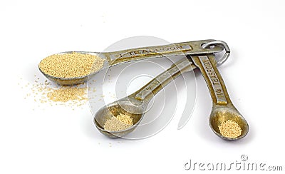 Vintage Measuring Spoons and Yeast Stock Photo