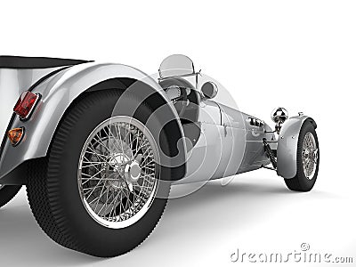 Vintage metallic silver open wheel sport racing car - rear wheel closeup shot Stock Photo