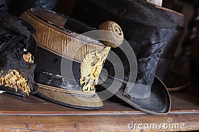 Vintage military cap and top hat Stock Photo