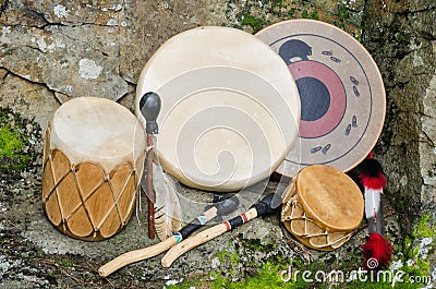 Four Native American Drums with Drumsticks. Stock Photo