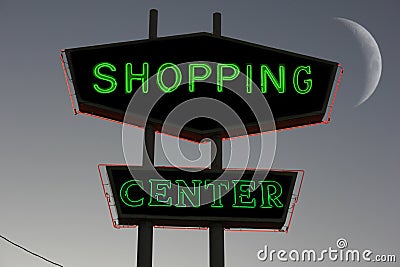 Vintage Neon Shopping Center Sign at night with Moon in background Stock Photo