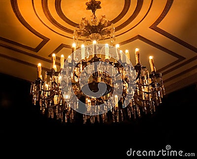 Chandelier Illuminates dark room Stock Photo