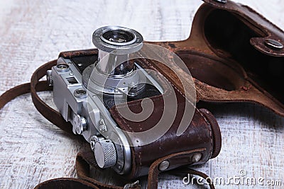 Vintage old film photo-camera in leather case Stock Photo