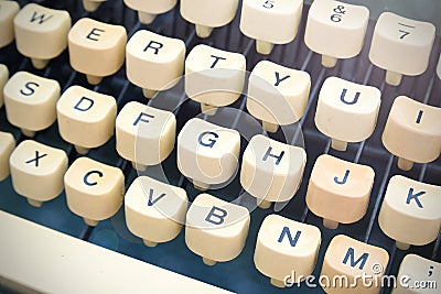 Vintage old typewriter keyboard diagonal rows forming a background Stock Photo