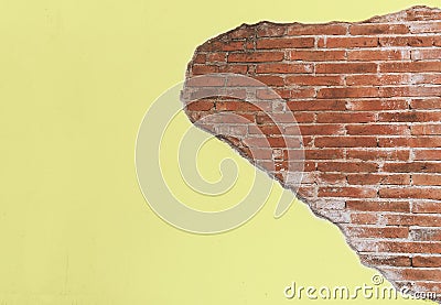 Vintage old yellow crack cement wall with red brick block Stock Photo