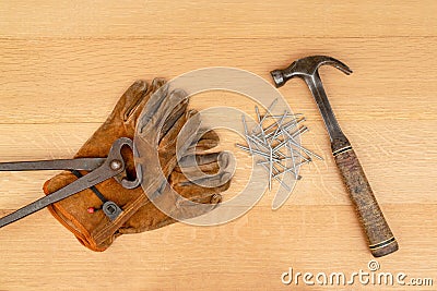 Vintage Pair Of Cutting Nippers Pliers Work Gloves Hammer Nails Wood Background Stock Photo