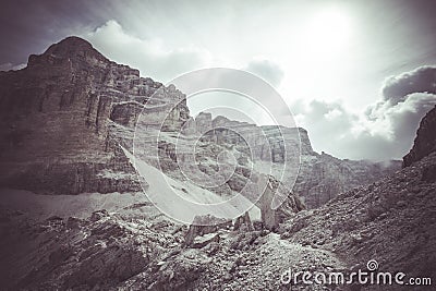 Vintage panorama of giant boulders expanse with Giussani Mountain Hut at the foot of Tofana summit Stock Photo