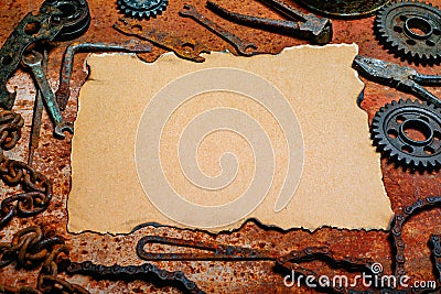 Vintage paper in the center tools on metal background. Motorcycle tools, equipment and repair Stock Photo